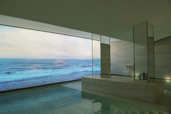 ocean scene projected onto a wall in an underground spa