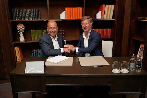 two business men signing a contract