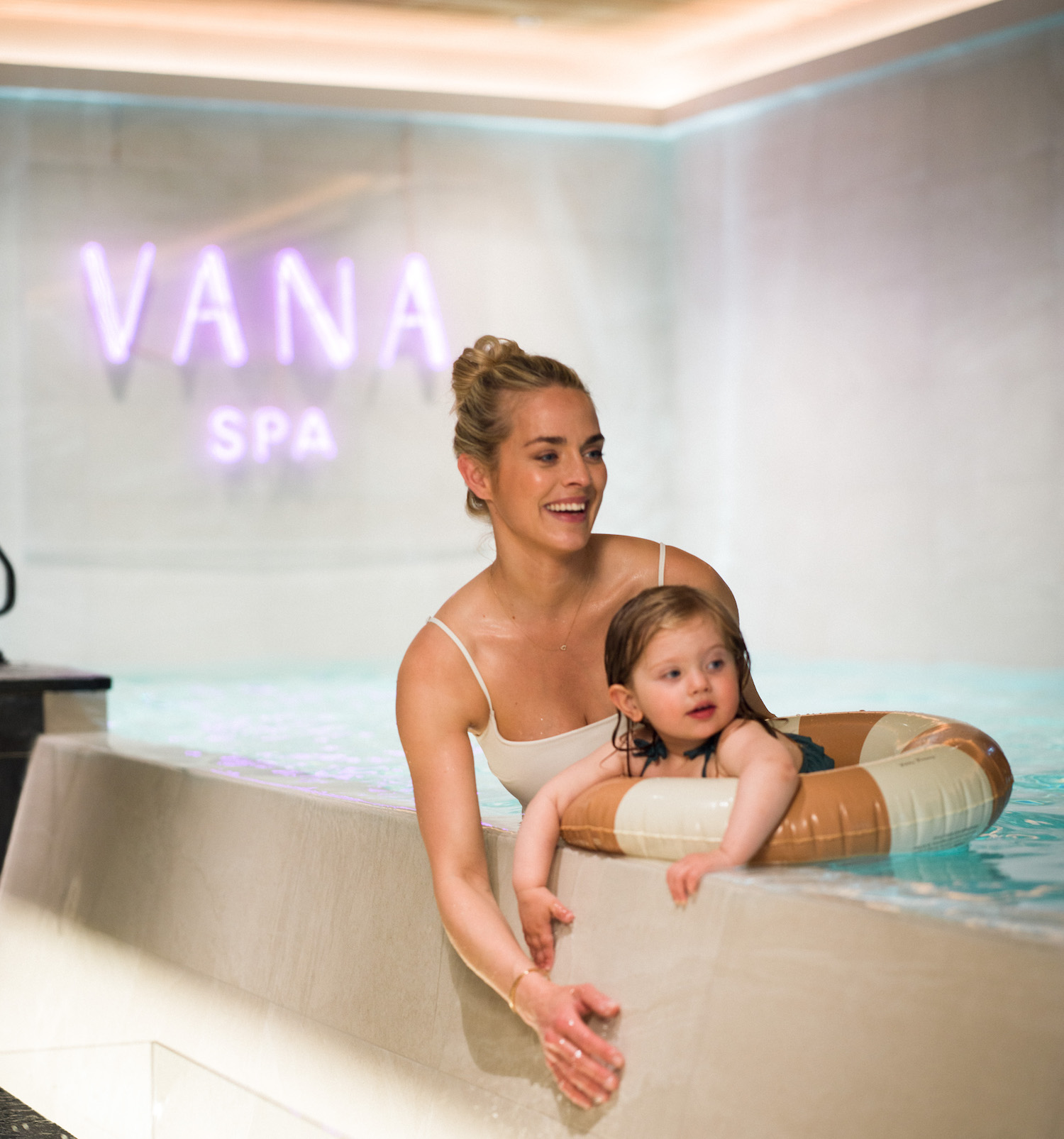 Woman and child in spa pool
