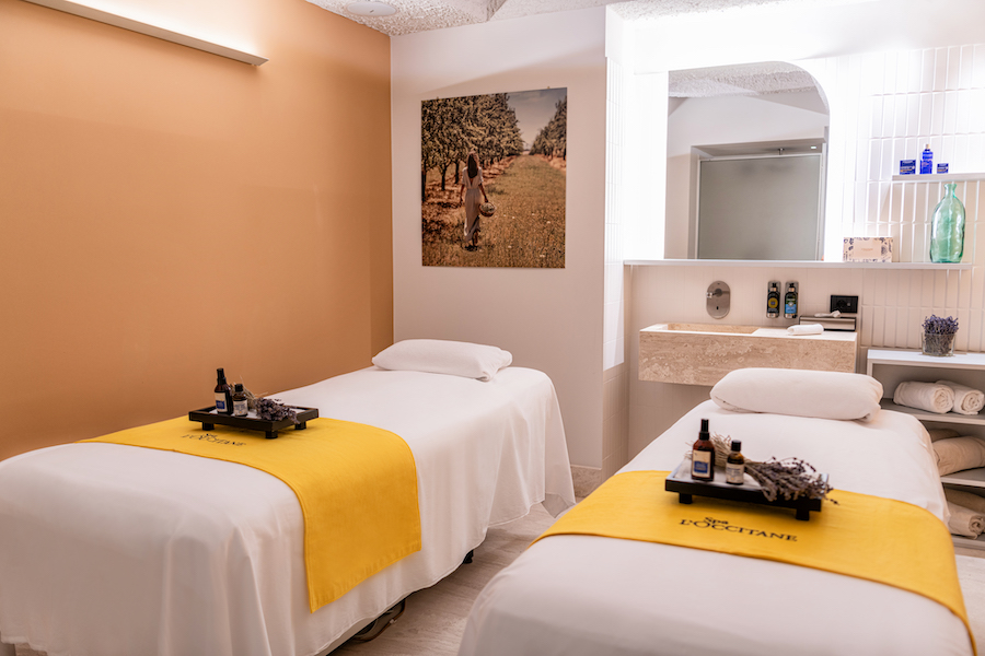 A double spa treatment room with yellow theming