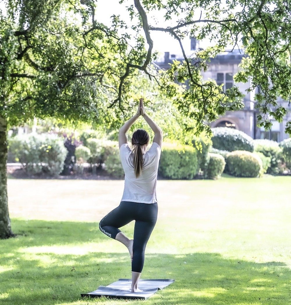 Woman doing yoga in tree pose