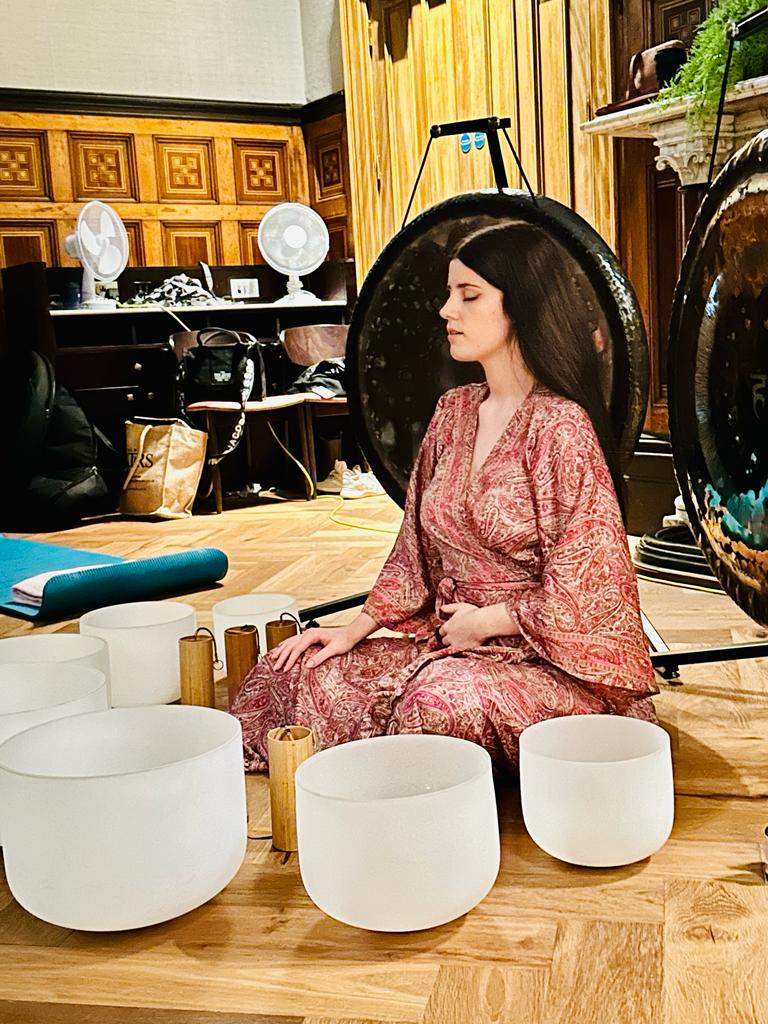 woman leading a sound healing session