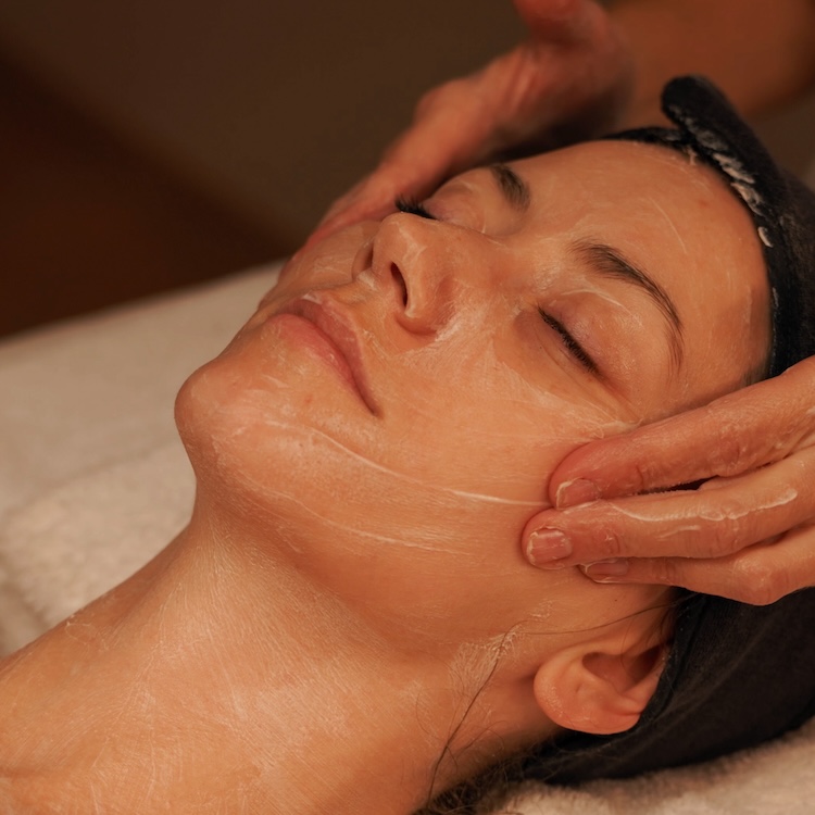 woman experiencing facial massage