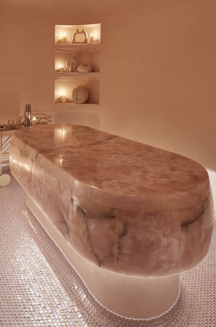 Pink spa treatment room with pink bed