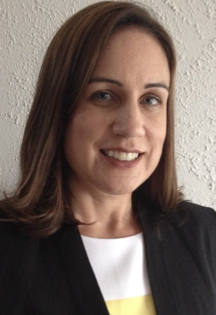 Women with brown hair smiling at camera