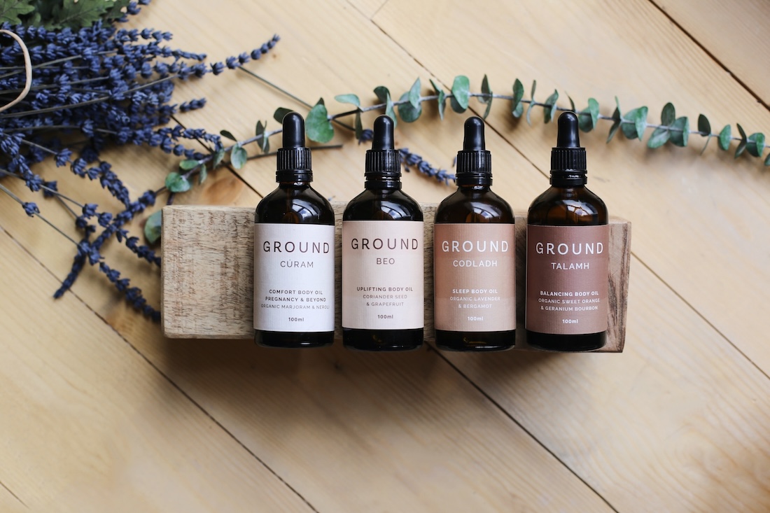 Four body oils in brown bottles