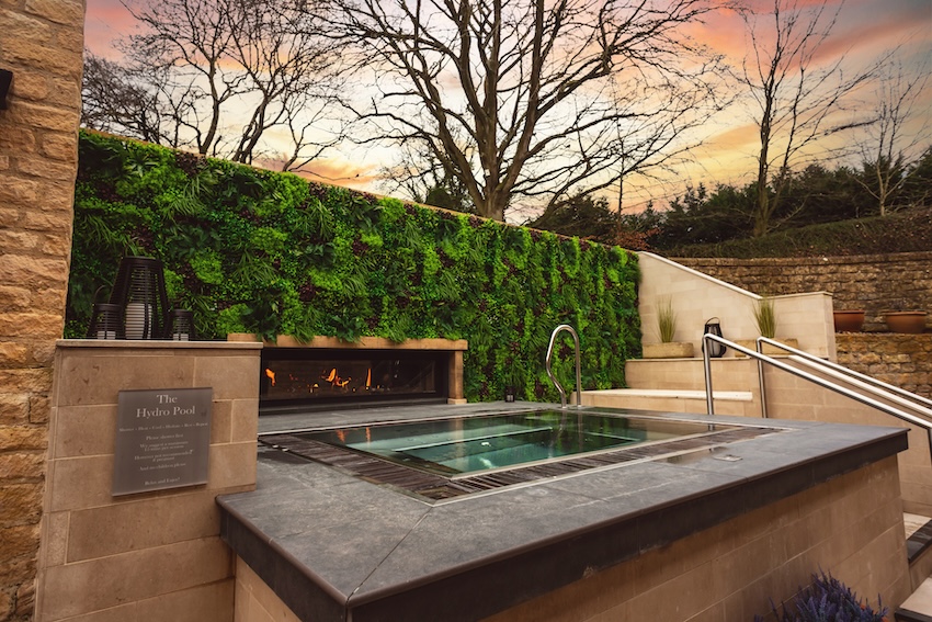 Outdoor spa pool pictured at sunset