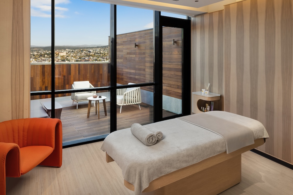 A spa treatment room with a balcony