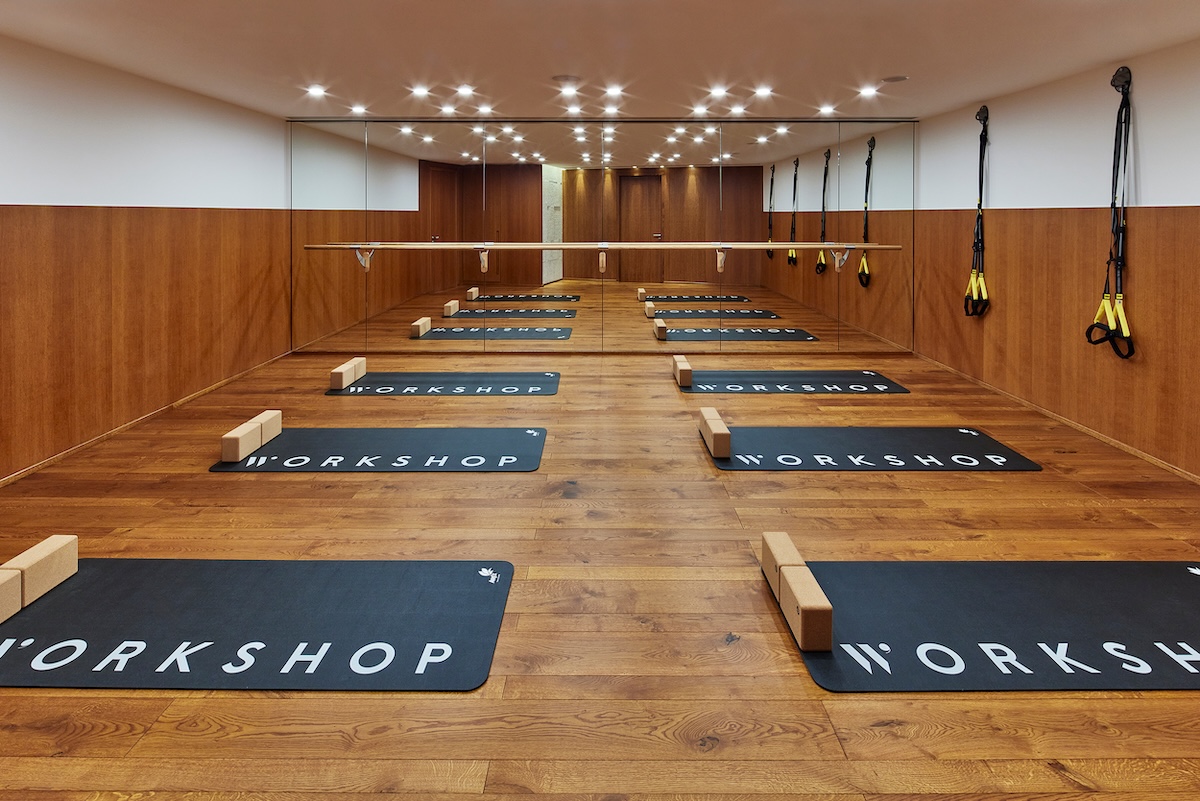 an exercise studio with yoga mats on the floor