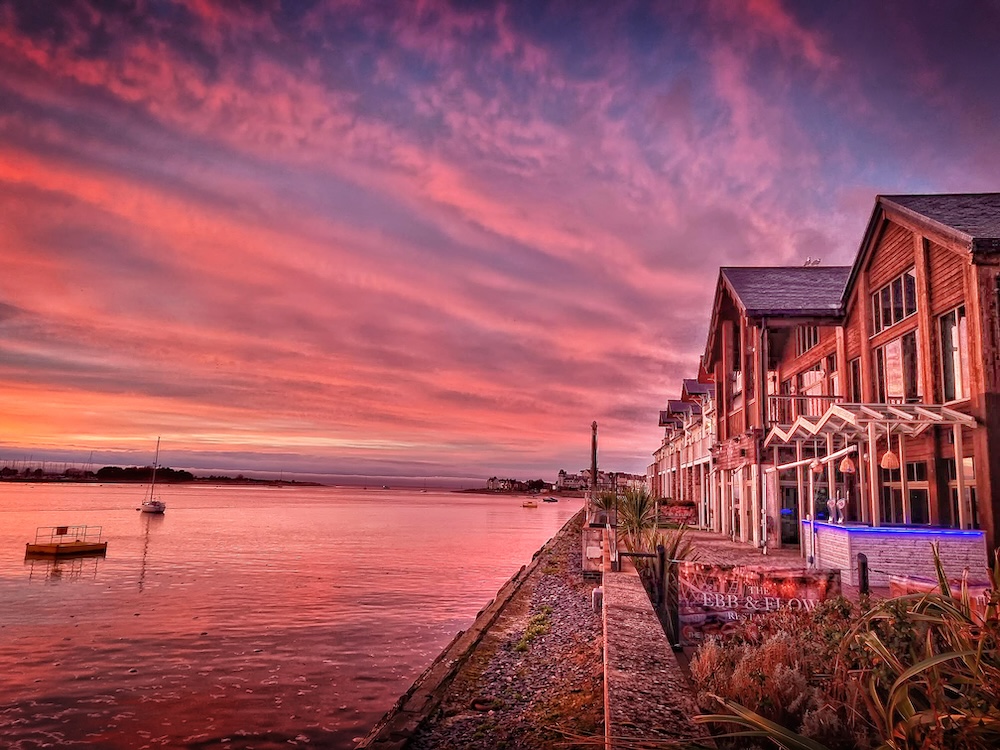 A hotel against the backdrop of a sunset