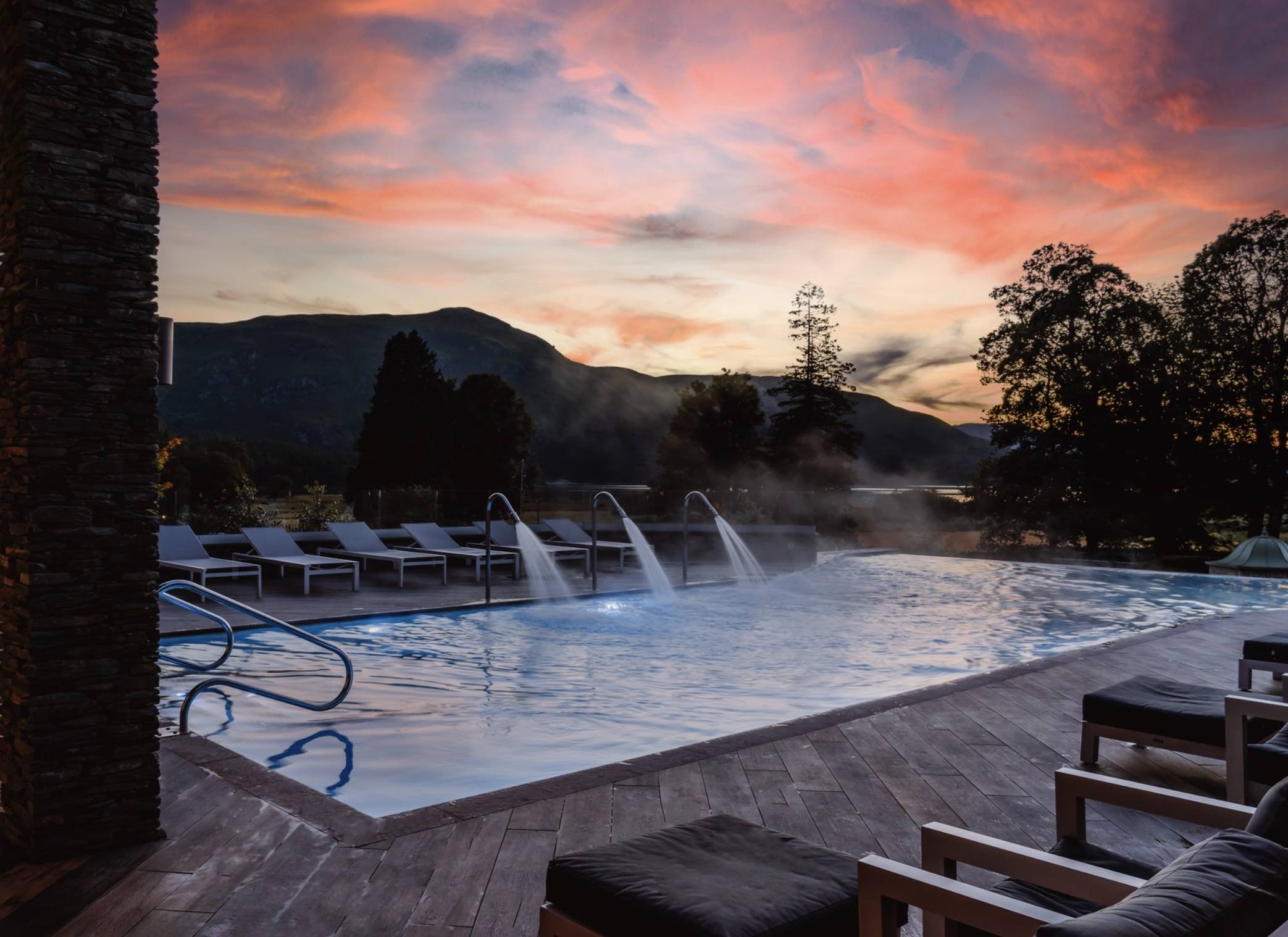 Outdoor swimming pool at sunset