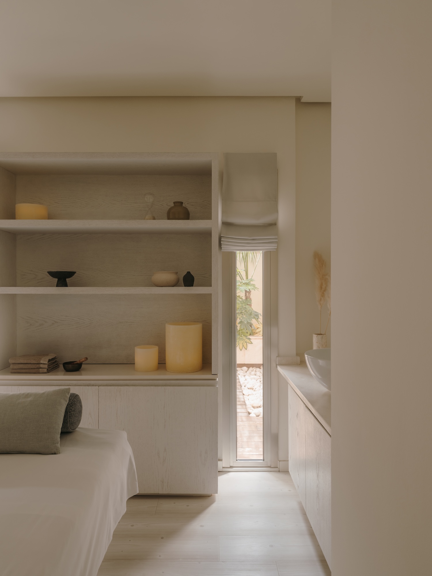 Spa treatment room in whites and muted beiges