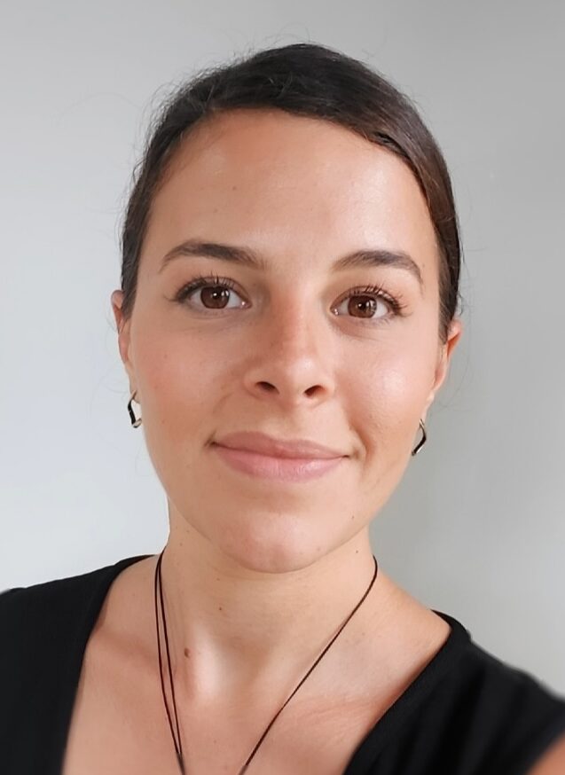 Woman with brown hair posing for the camera