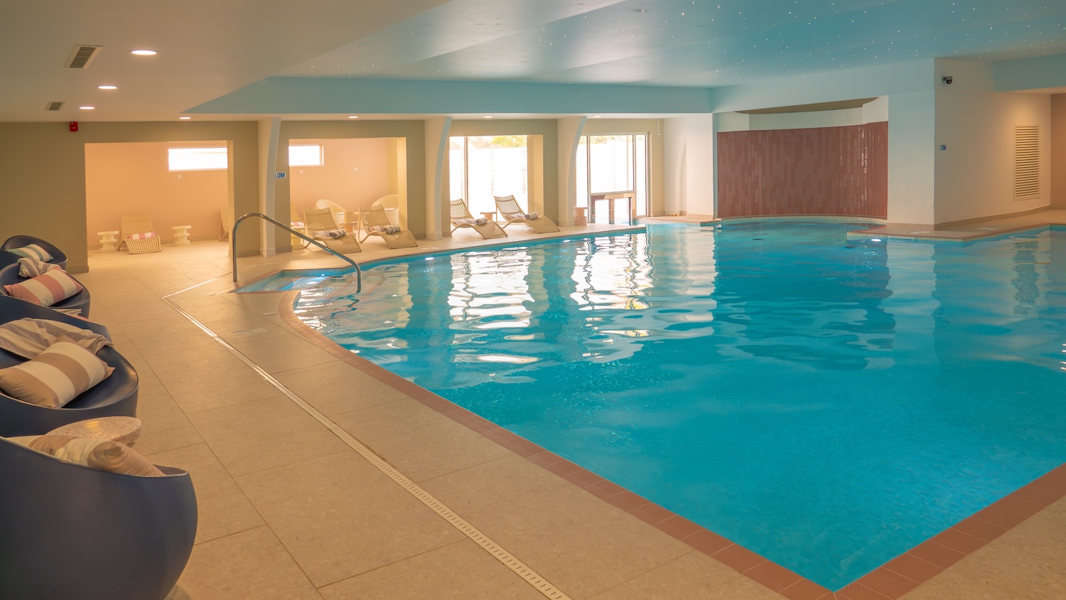 A large pool within a hotel