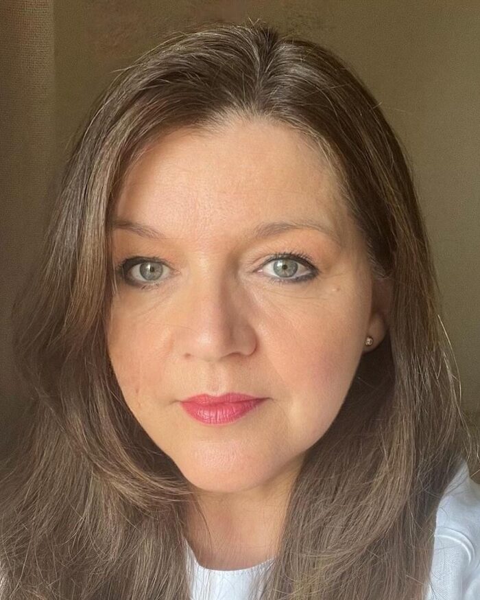 Close up head shot of woman with brown hair