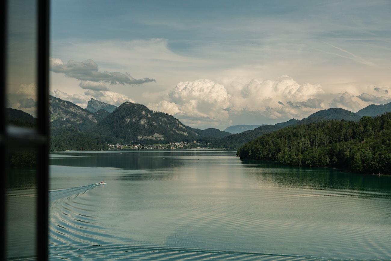 The view of an austrian lake and the alps from a window