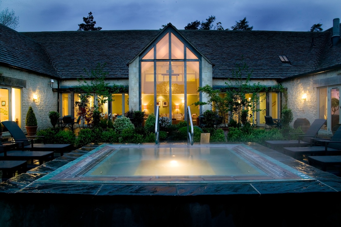 An outdoor spa pool viewed at night