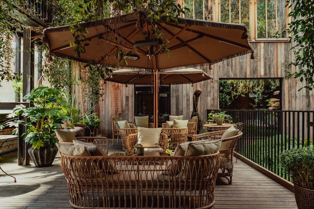 A leafy green hotel terrace