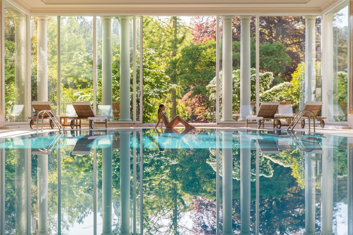 Woman relaxing by a spa swimming pool