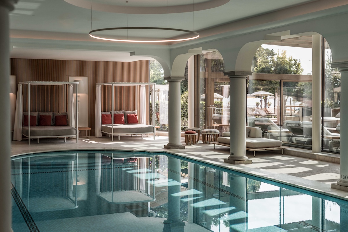 A large swimming pool in a sunlit spa