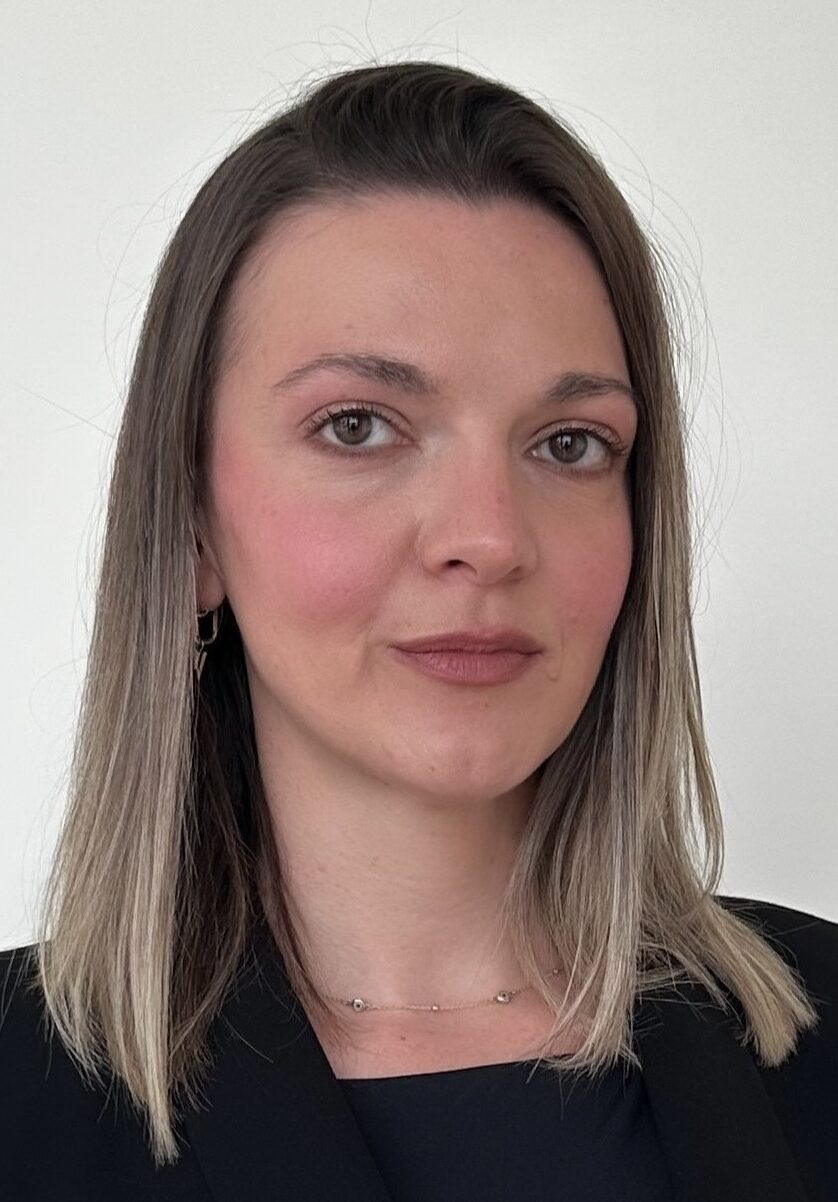 Headshot of woman in black top