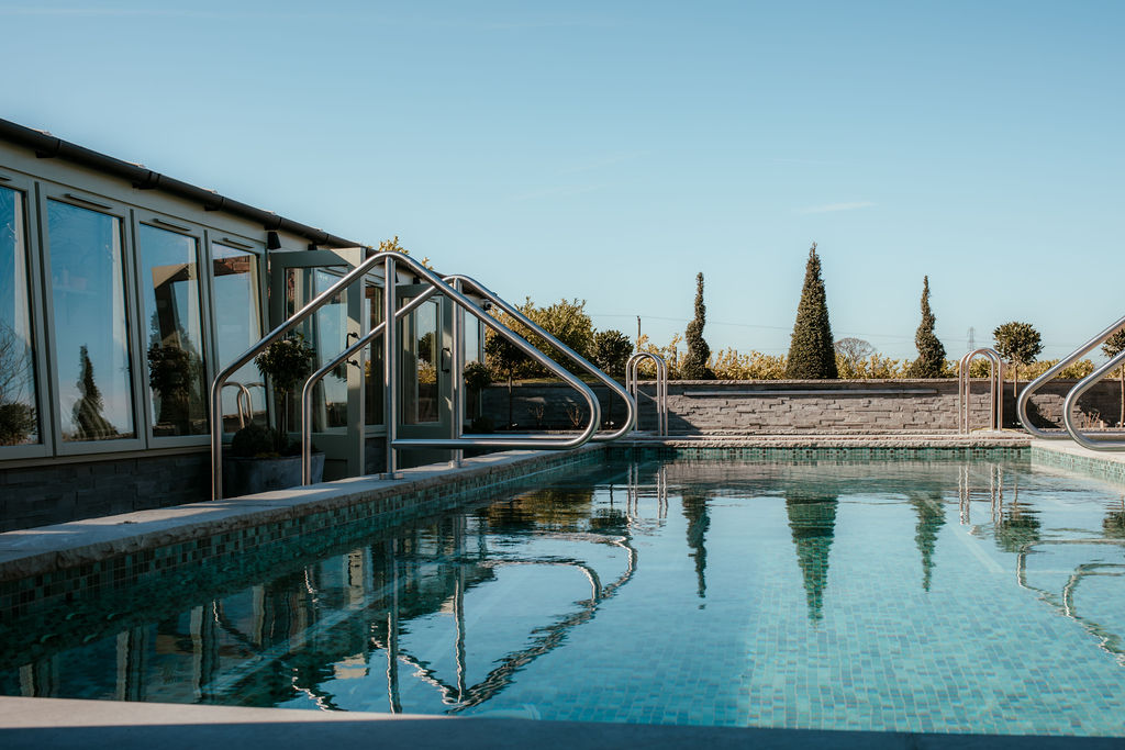 An outdoor swimming pool on a sunny day