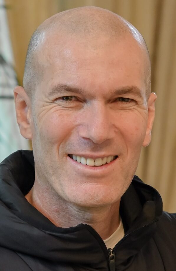 Smiling man with bald head in black jacket