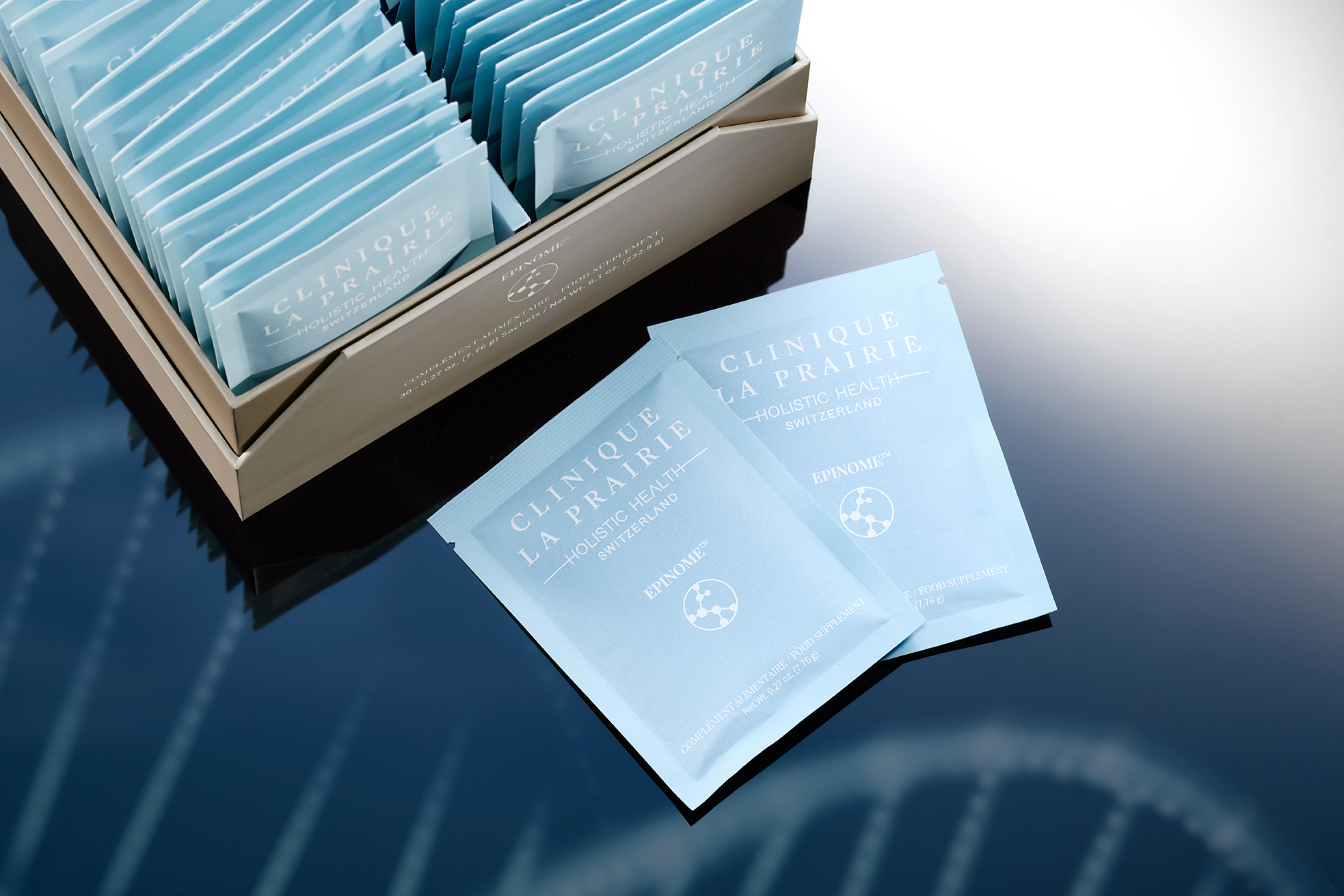 Some sachets of beauty product next to a blue box Clinique La Prairie launches Epinome and Advanced Longevity Diagnostics