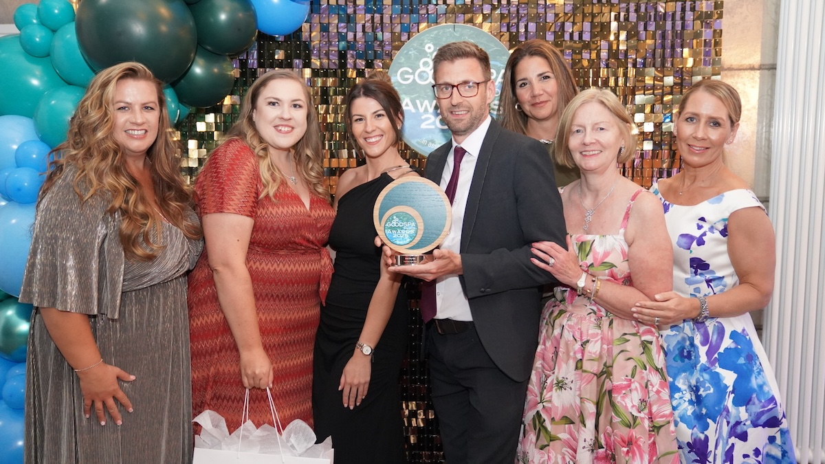 A group of people collecting a good spa guide award