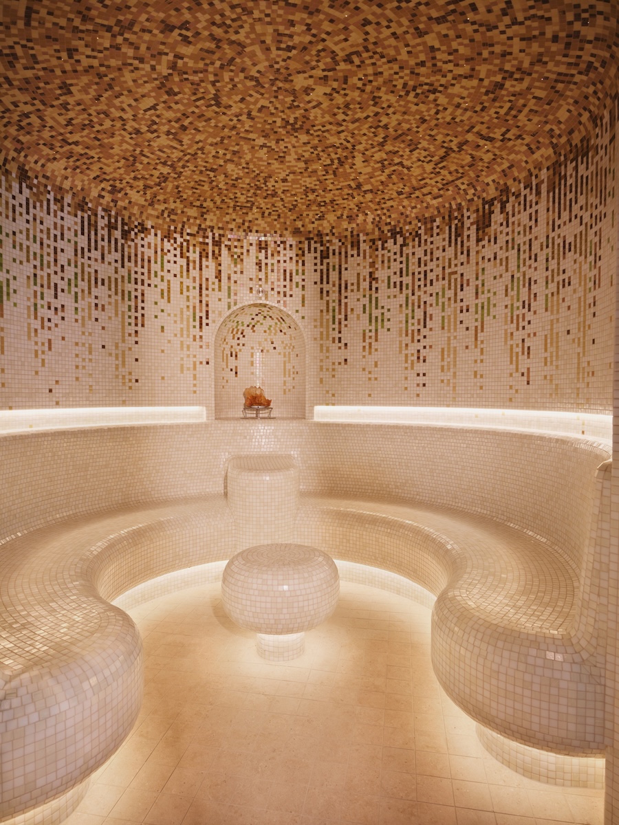 a steam room with mosaic tiles