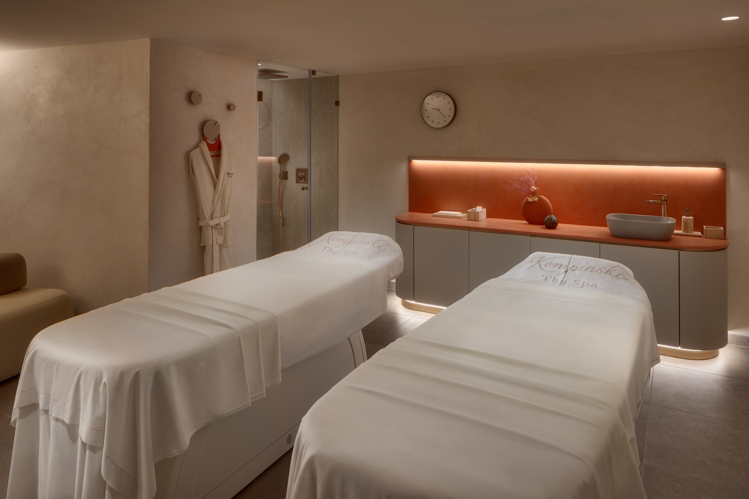A double treatment room with two beds in a spa