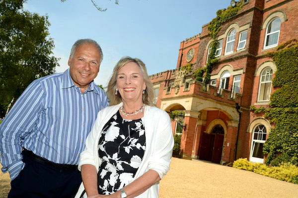 couple standing in front of an old heritage building