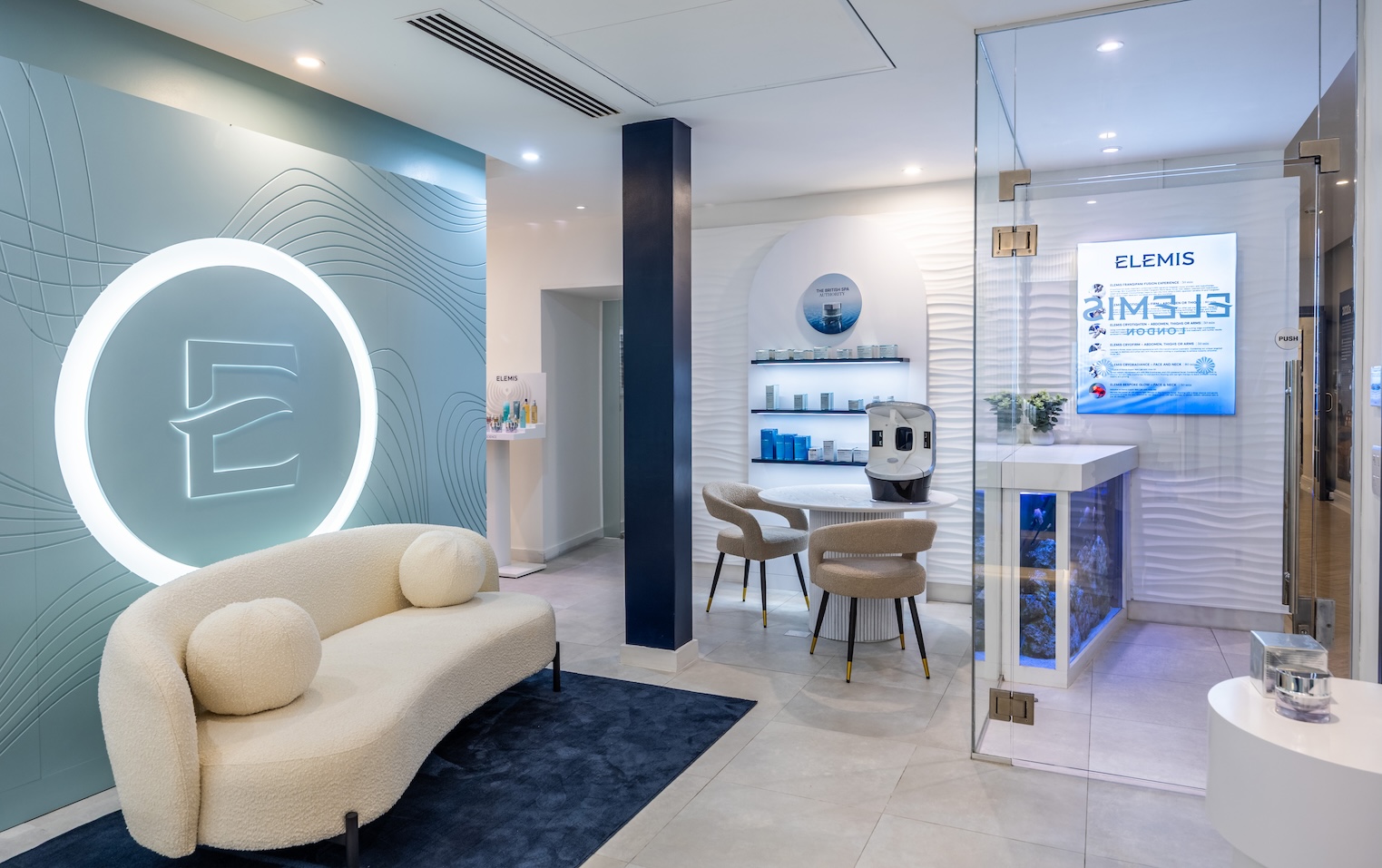 A spa area with sofa and large E on the wall