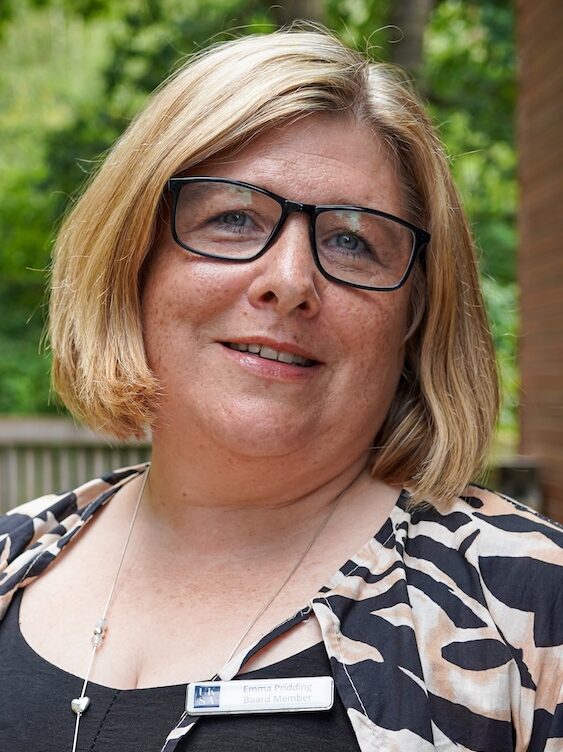 Woman in animal print shirt wearing glasses