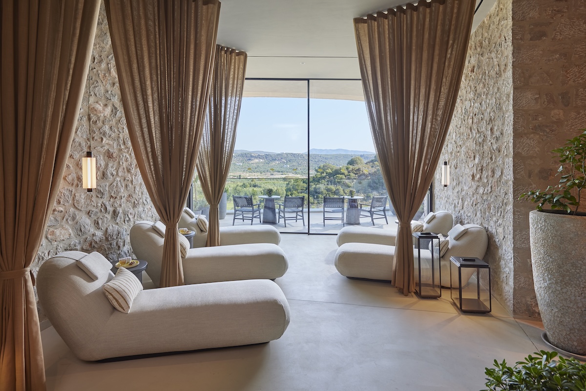 A spa relaxation area overlooking a mediterranean view