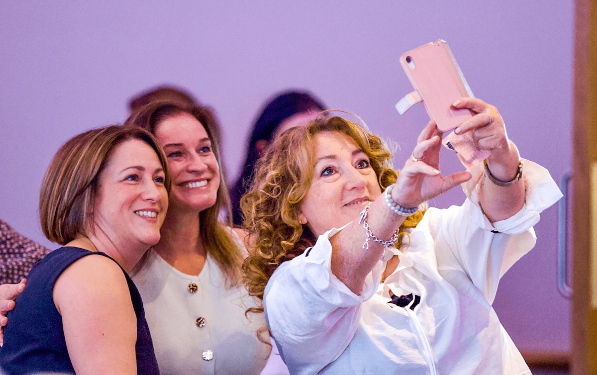 Three women posing for a selfie