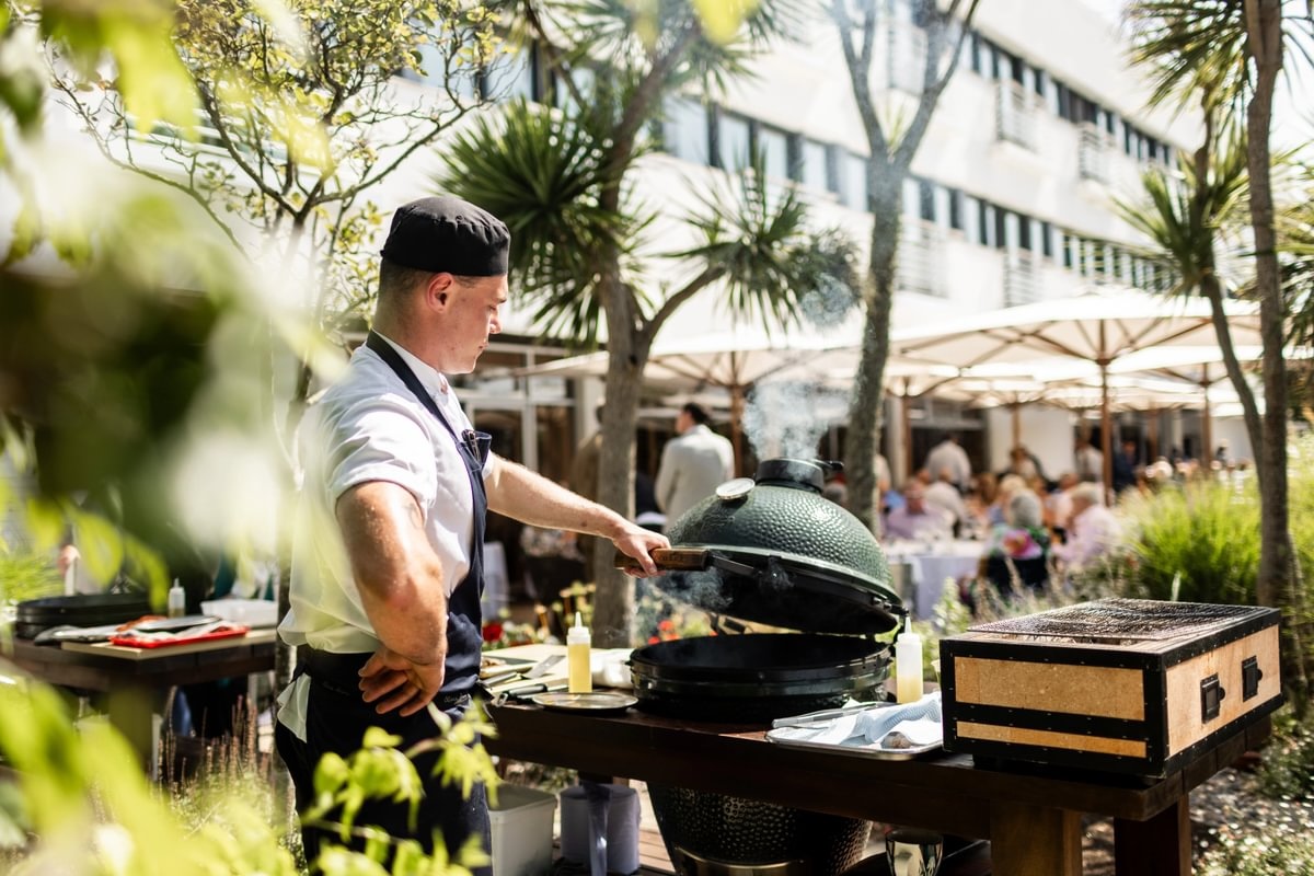 Chef cooking at a BBQ in the sunshine