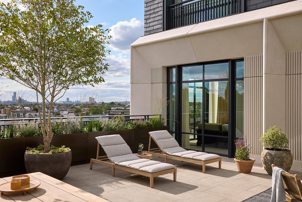 A hotel terrace in the sun overlooking london skyline