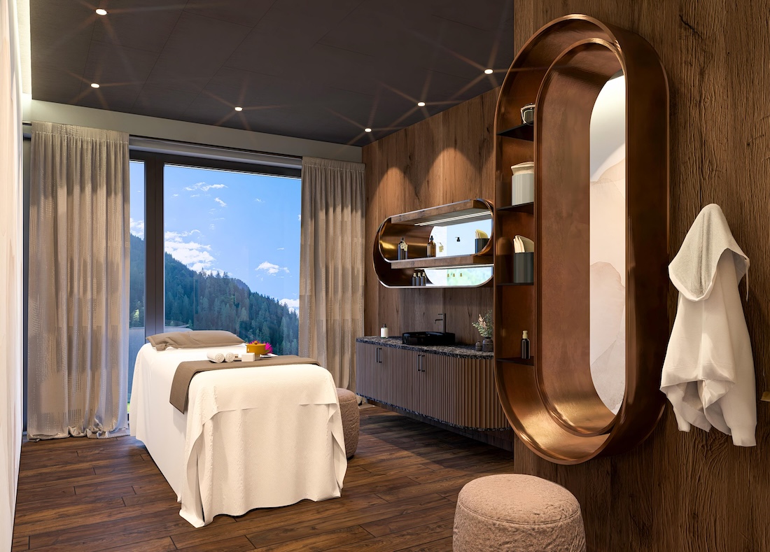 A treatment room in a spa with an alpine view from the window