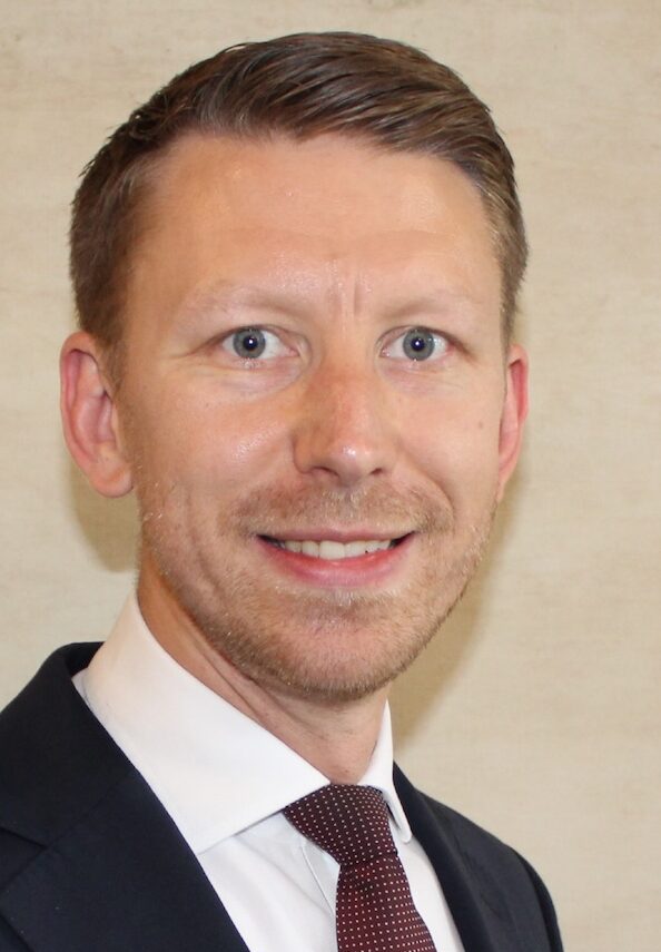 Man in suit smiling for the camera