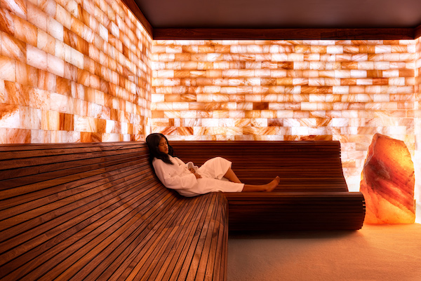 Himalayan Salt Suite with woman relaxing on the bench