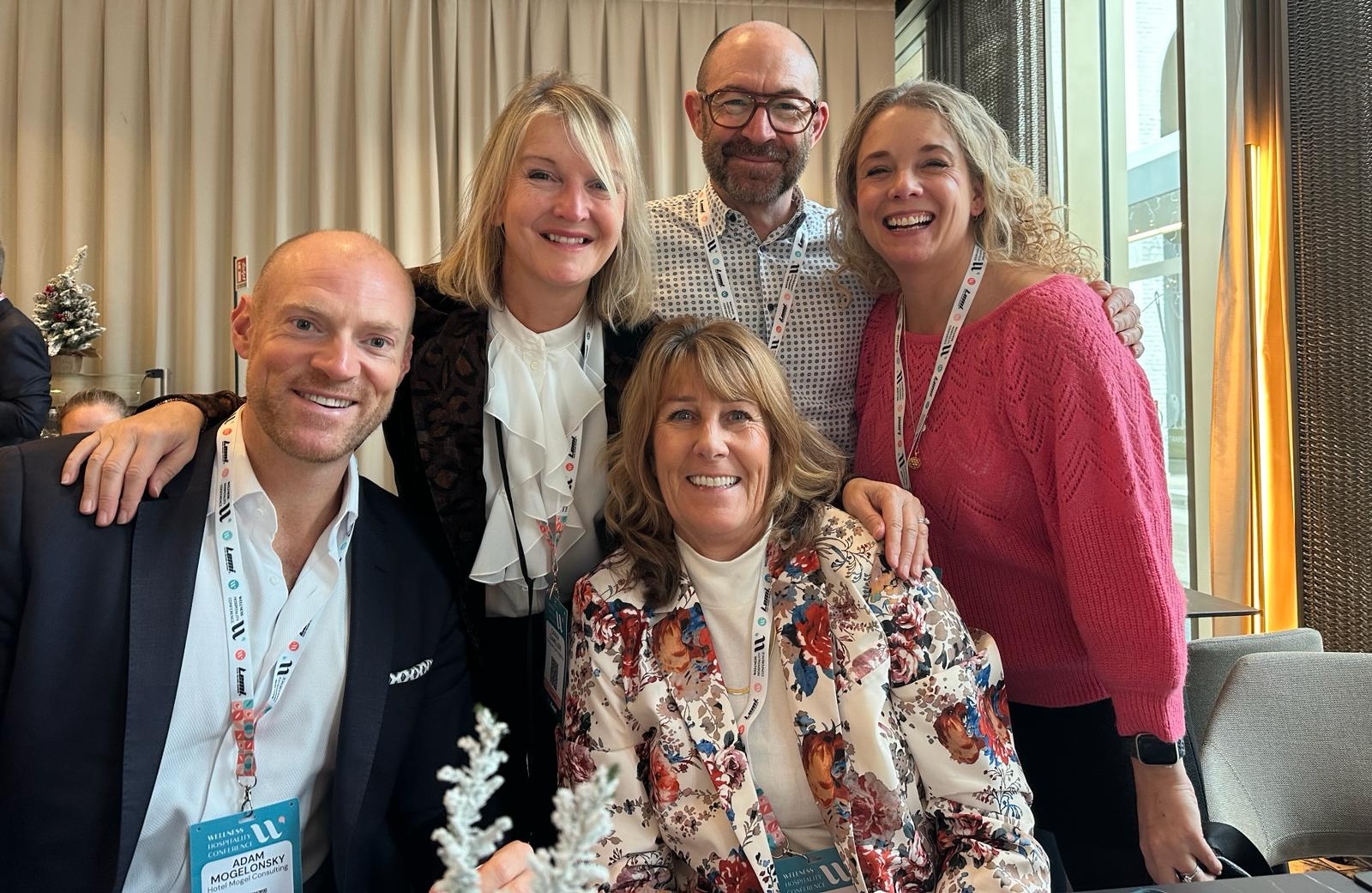 People posing for the camera in a business setting