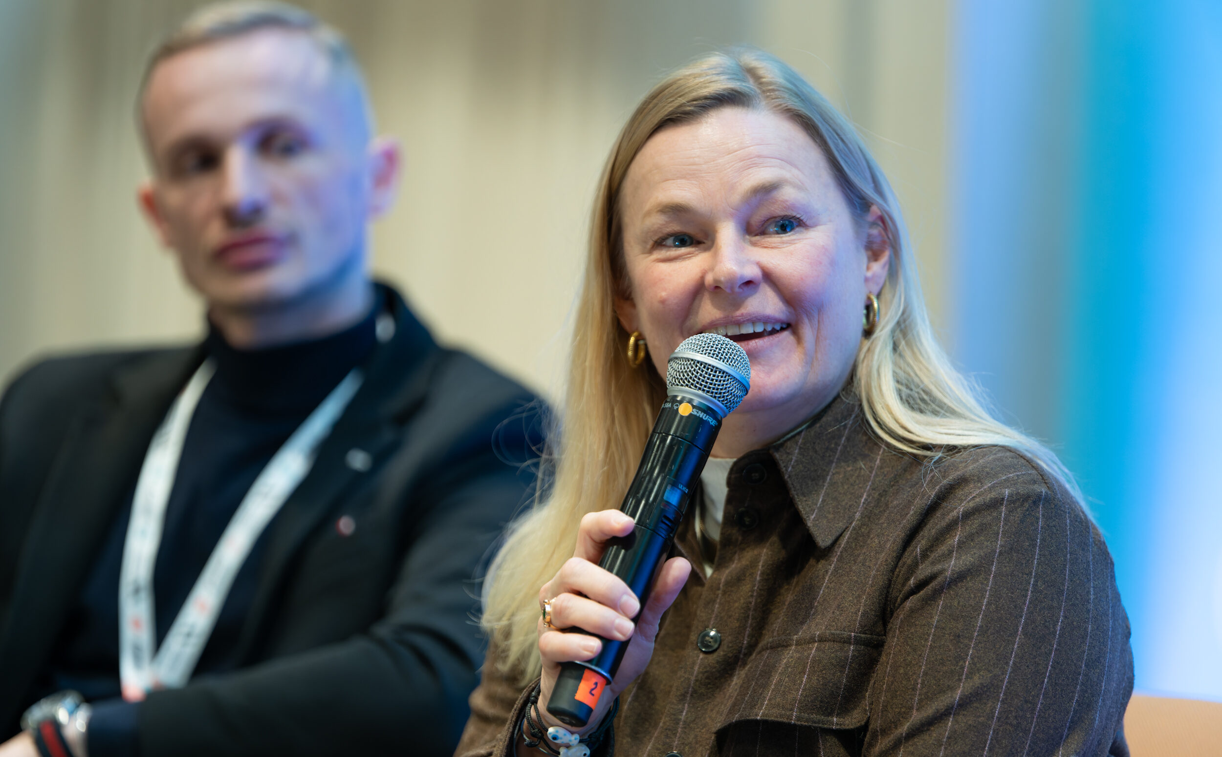 Woman speaking into microphone