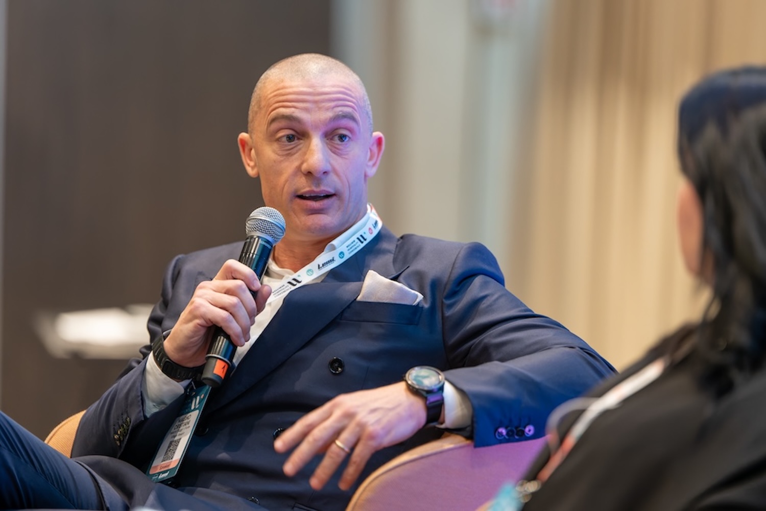 Man speaking into microphone