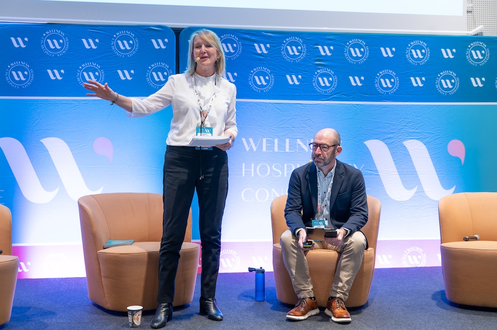 Two people presenting on a stage