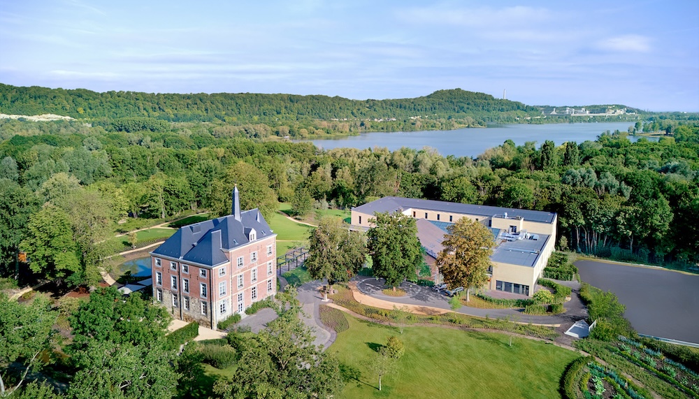 Aerial view of hotel next to a lake