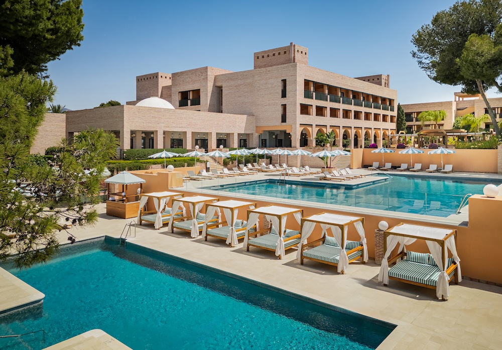 Outdoor view of luxury hotel with two swimming pools