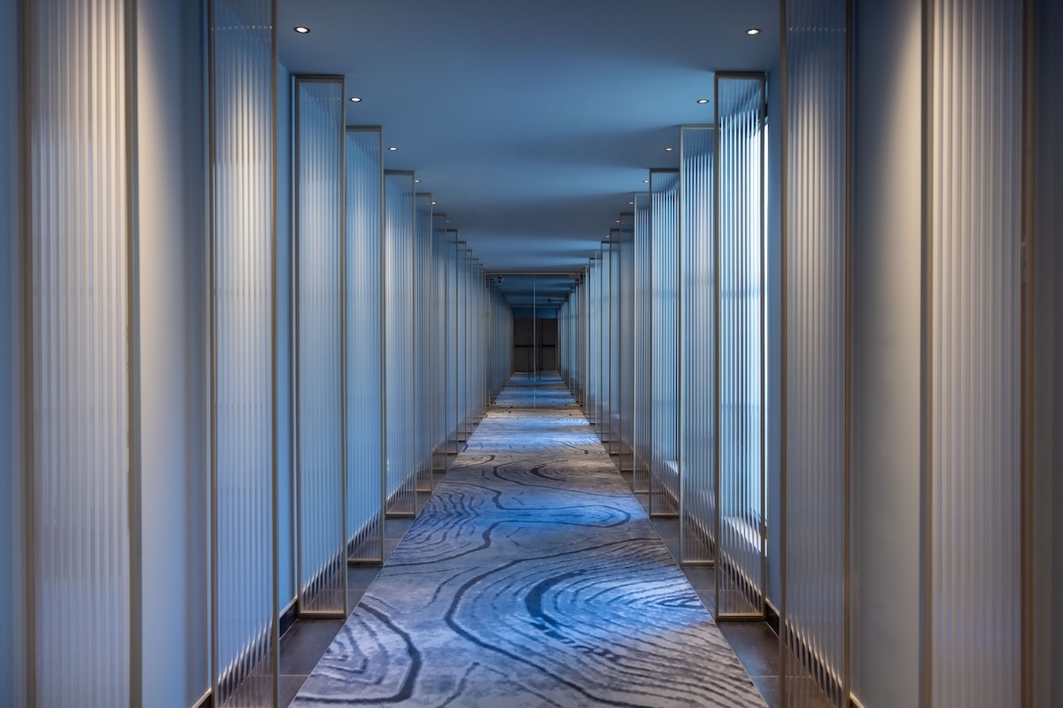 blue lit corridor in a spa