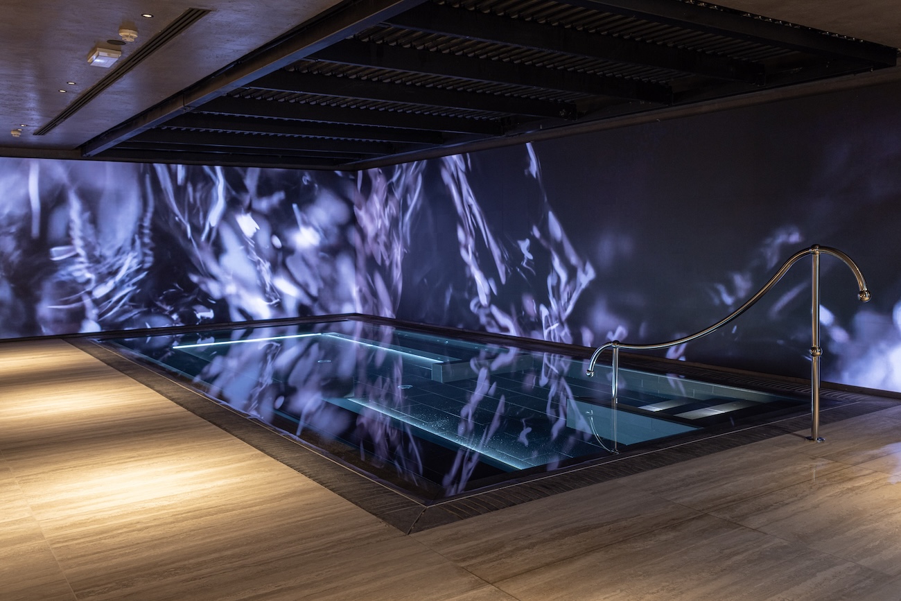 spa pool with fake rain and dramatic backdrop