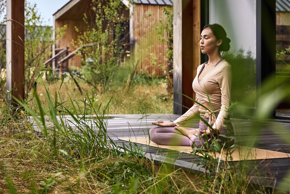 Woman sat cross legged doing yoga